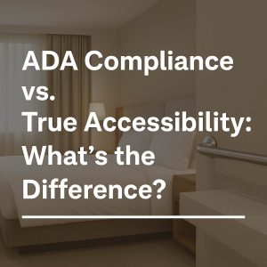 Elegant modern hotel bathroom showing ADA-compliant grab bar and floating vanity with accessible design, representing inclusive luxury.